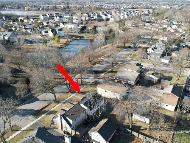 an aerial view of residential houses with outdoor space