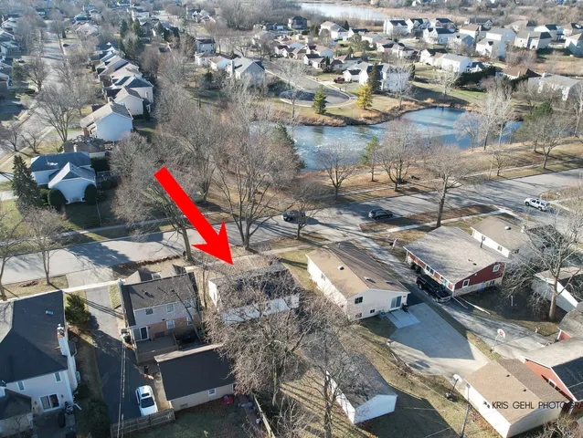 an aerial view of residential houses with outdoor space