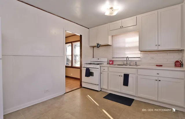 a view of a kitchen with a sink and dishwasher