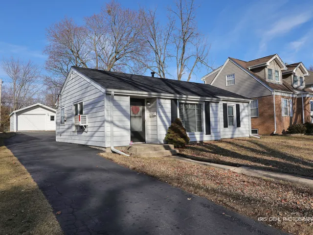 a view of a house with a snow in the yard