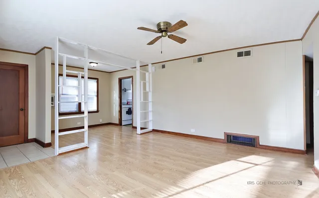 a bathroom with a sink and mirror with bathtub