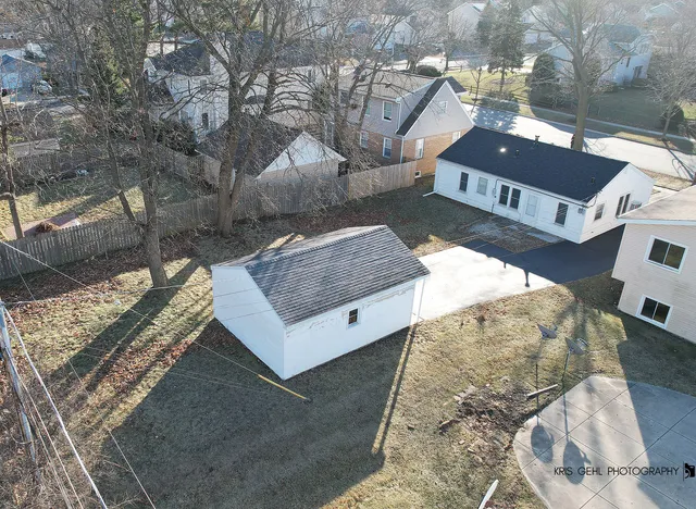 a view of house with a yard