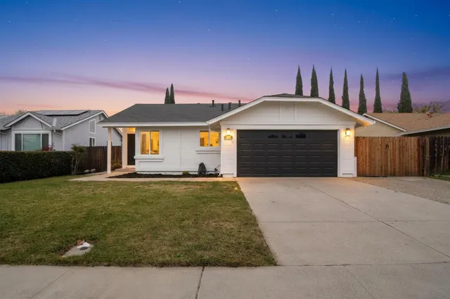 a front view of a house with yard