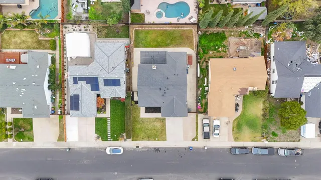 an aerial view of a residential apartment building with a yard