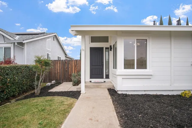 a front view of a house with garden