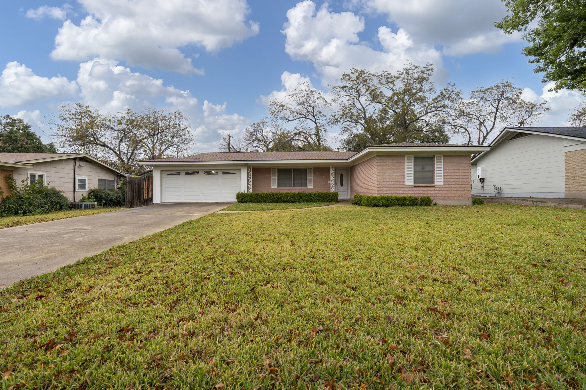 1800 Barbara Street Austin, TX 78757 - Photo 1 of 1 front view of a house with a yard