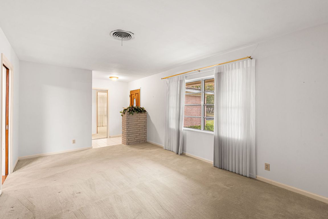 1800 Barbara Street Austin, TX 78757 - Photo 13 of 37 a view of an empty room with a window