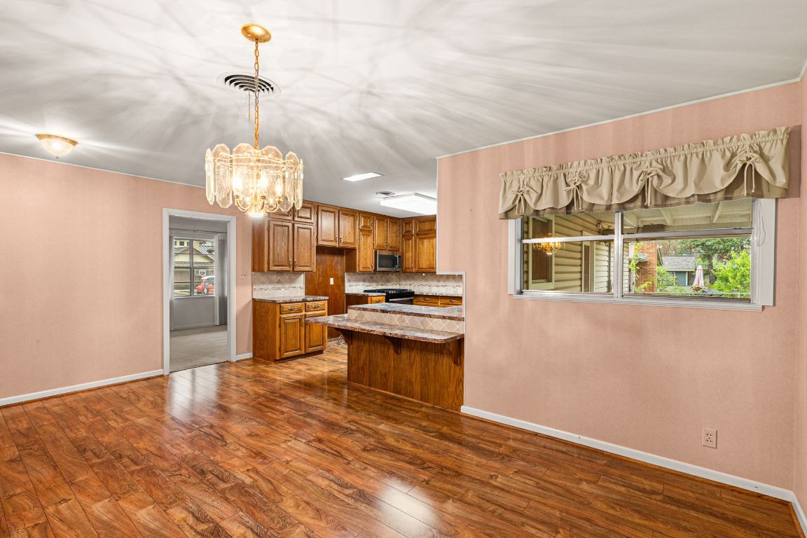 1800 Barbara Street Austin, TX 78757 - Photo 16 of 37 a open kitchen with stainless steel appliances granite countertop a stove and a refrigerator