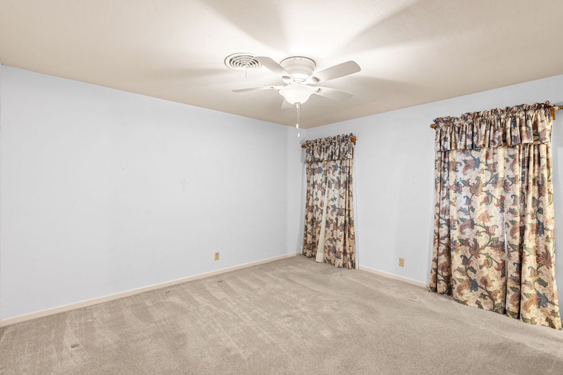 1800 Barbara Street Austin, TX 78757 - Photo 19 of 37 an empty room with windows and fan