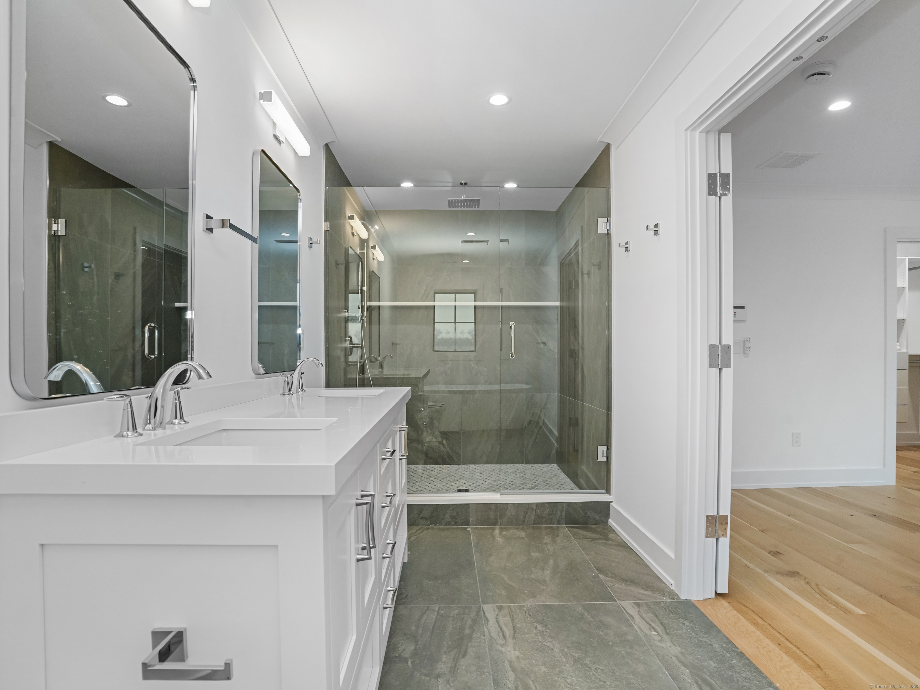 345 Reef Road, Unit C9 Fairfield, CT 06824 - Photo 23 of 39 a bathroom with a sink shower and a mirror