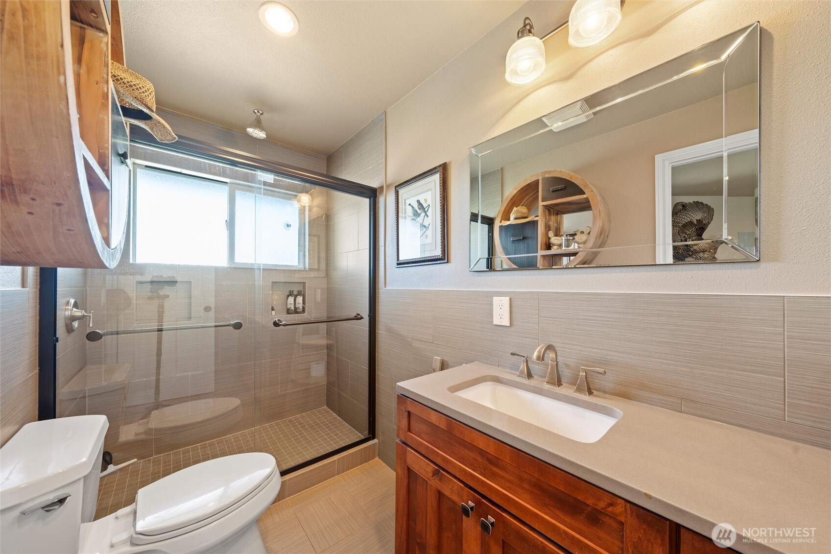 8708 Rd K Northeast Moses Lake, WA 98837 - Photo 11 of 40 a bathroom with a granite countertop toilet sink and mirror