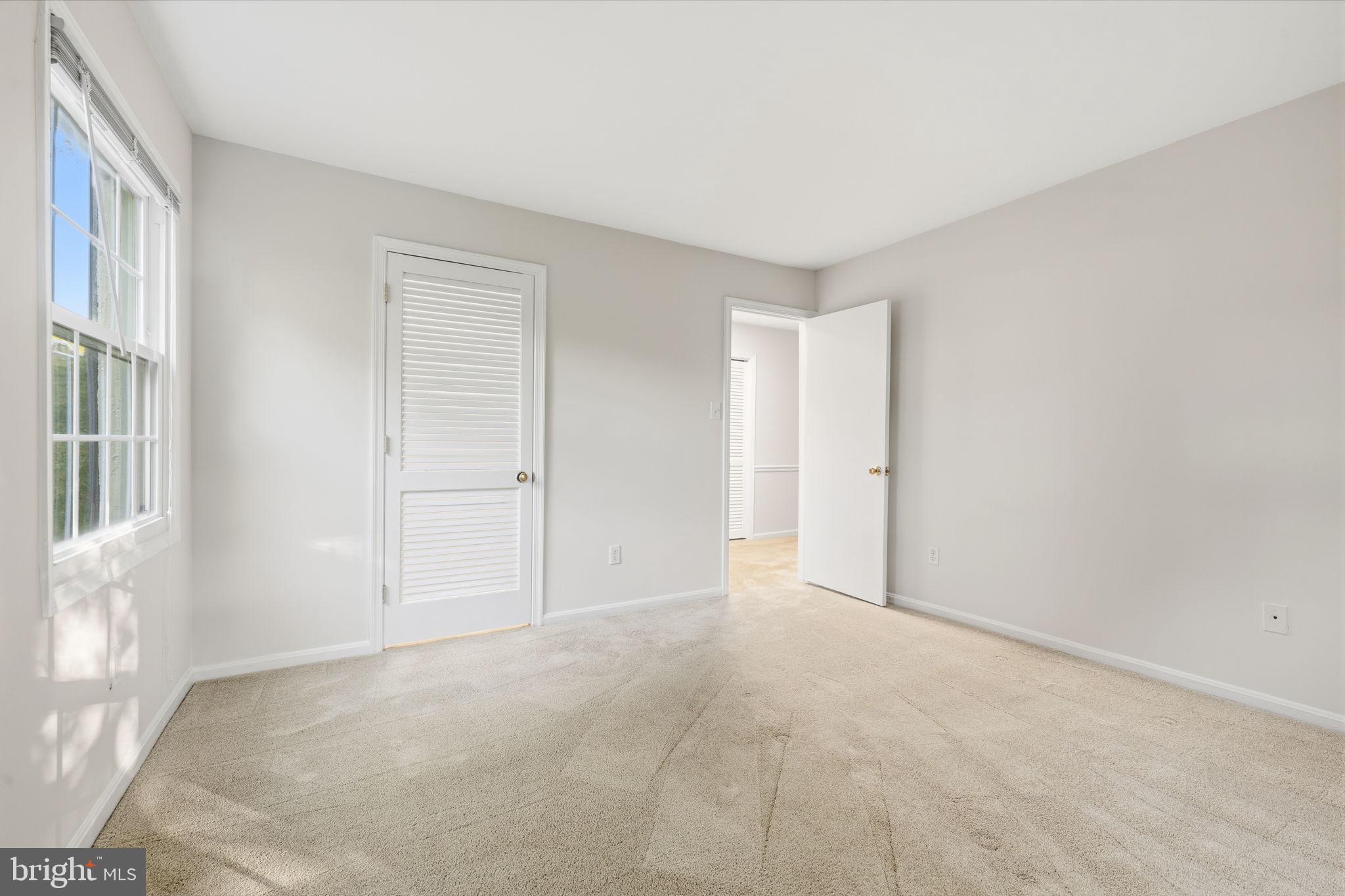 5817 Rexford Drive, Unit 798 Springfield, VA 22152 - Photo 13 of 23 a view of an empty room with a window
