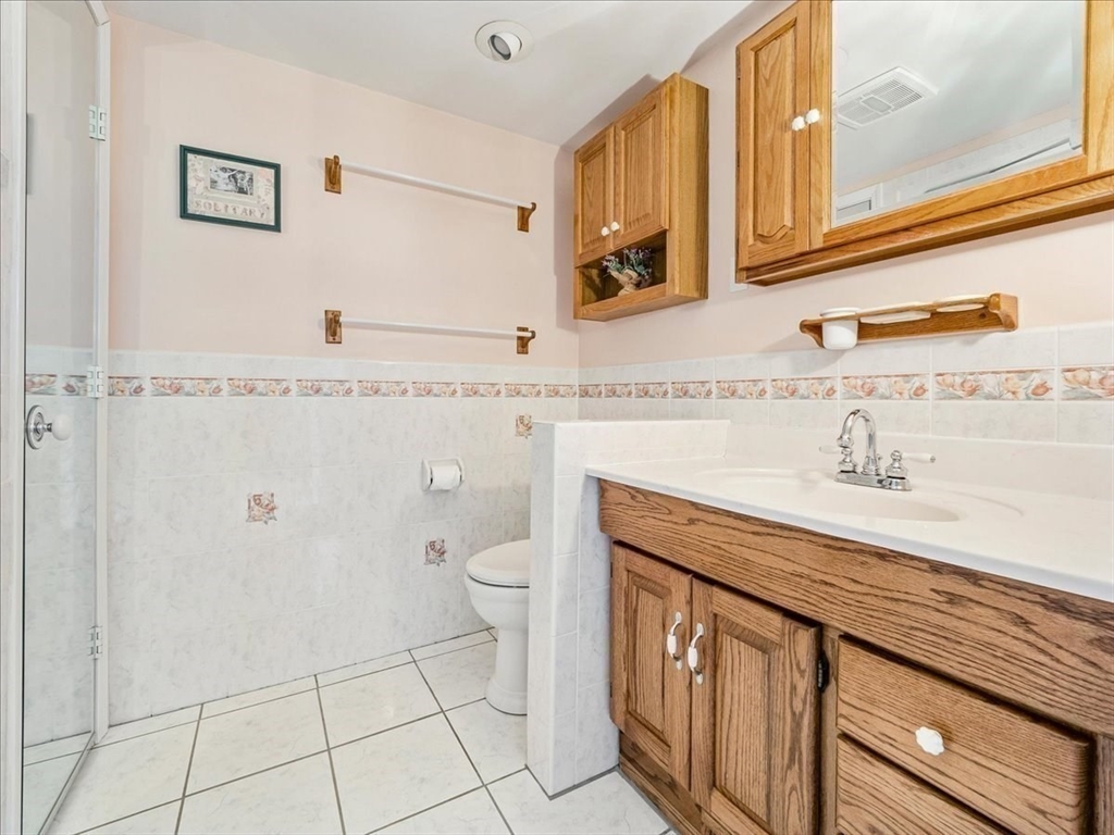 7 Ell Road Holbrook, MA 02343 - Photo 15 of 34 a bathroom with a sink a toilet and mirror