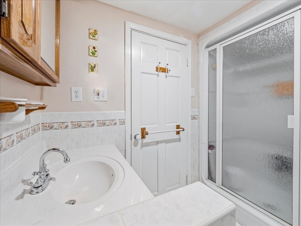 7 Ell Road Holbrook, MA 02343 - Photo 16 of 34 a bathroom with a sink and a mirror