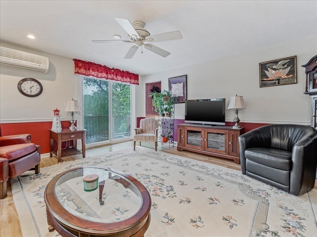 7 Ell Road Holbrook, MA 02343 - Photo 19 of 34 a living room with furniture and a flat screen tv