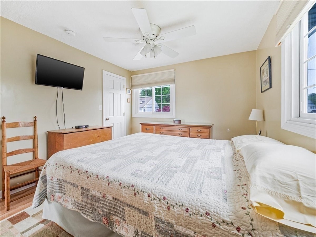 7 Ell Road Holbrook, MA 02343 - Photo 23 of 34 a bedroom with a bed and a flat screen tv