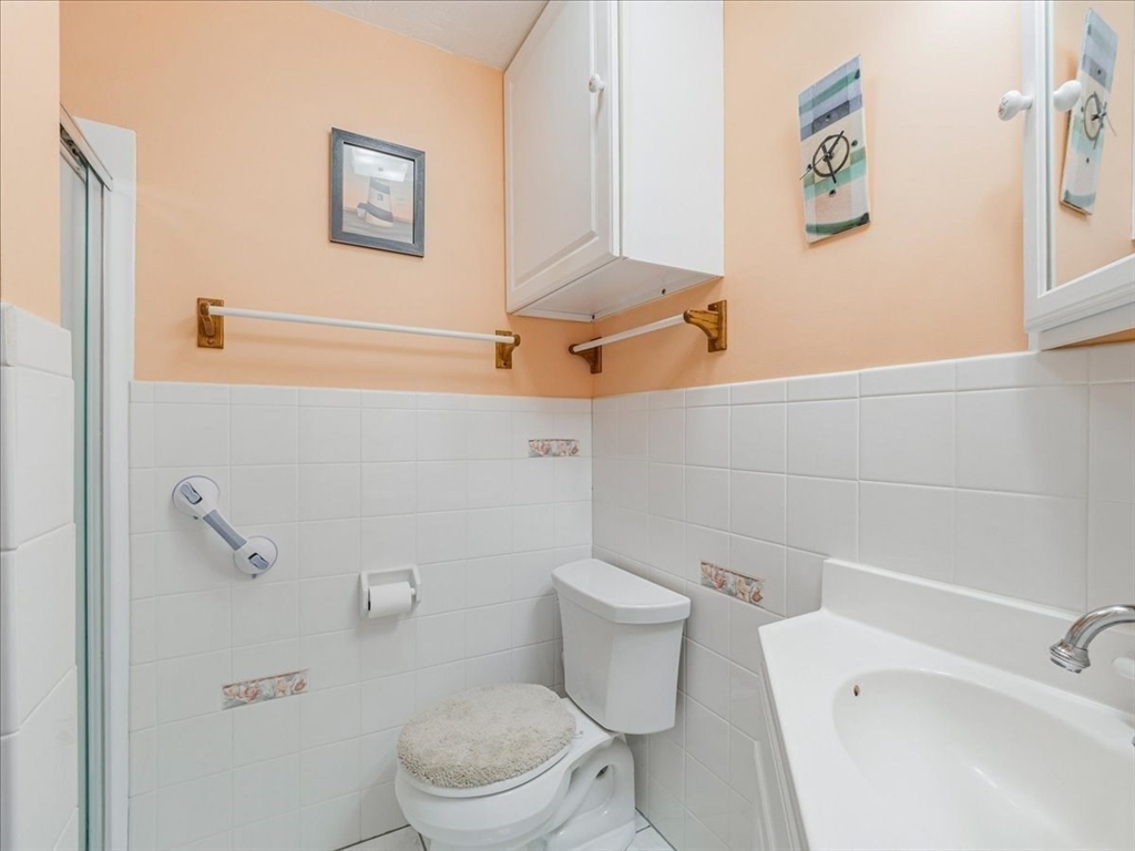 7 Ell Road Holbrook, MA 02343 - Photo 24 of 34 a white toilet sitting next to a bath tub