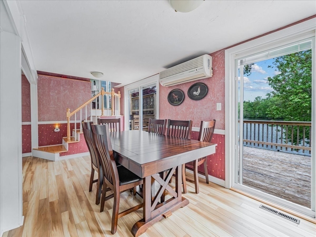 7 Ell Road Holbrook, MA 02343 - Photo 9 of 34 a view of a dining room and hall with wooden floor