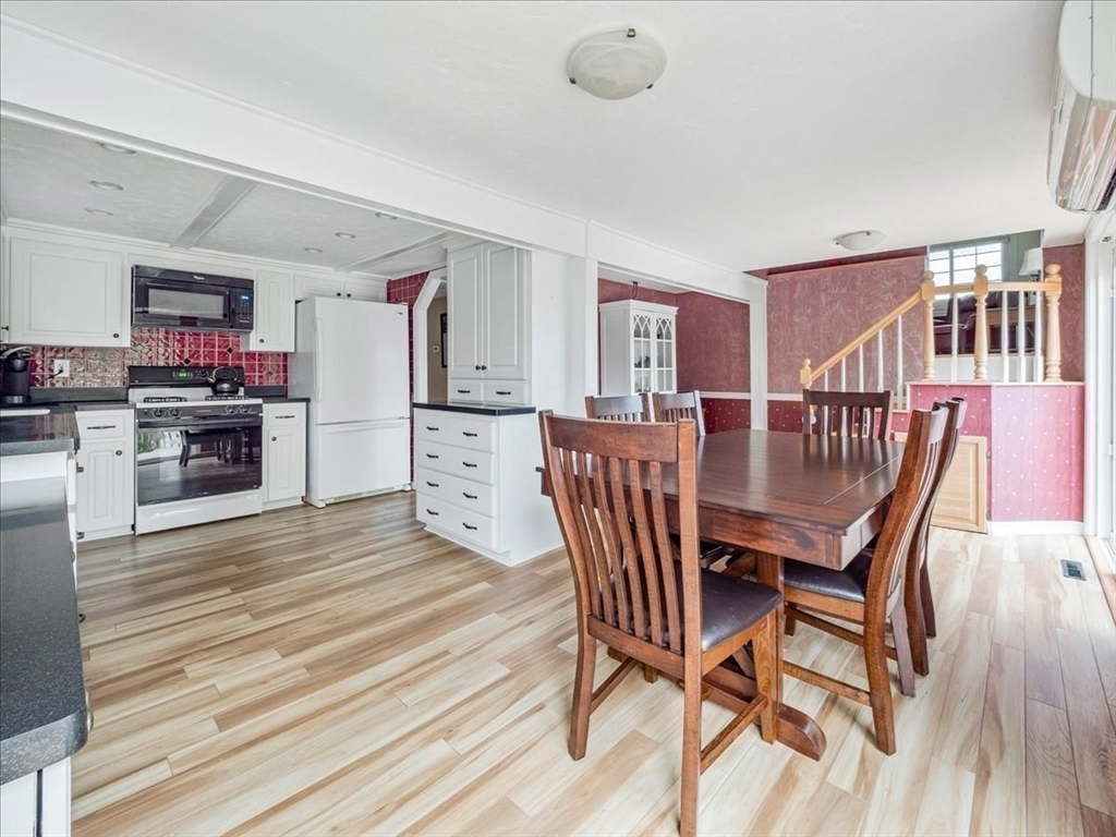 7 Ell Road Holbrook, MA 02343 - Photo 10 of 34 a view of a dining room with furniture and wooden floor