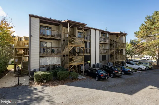 a view of a street that has couple of cars parked on the road