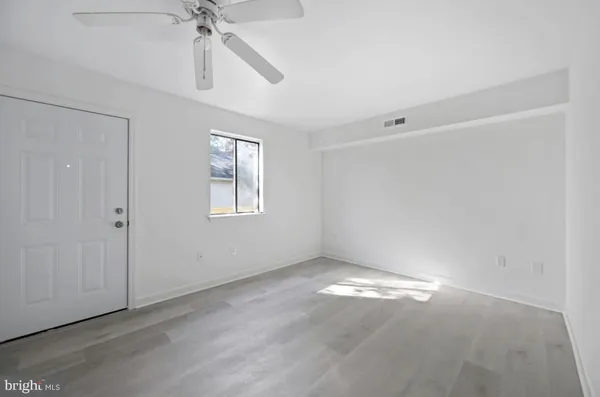 a view of an empty room with a window