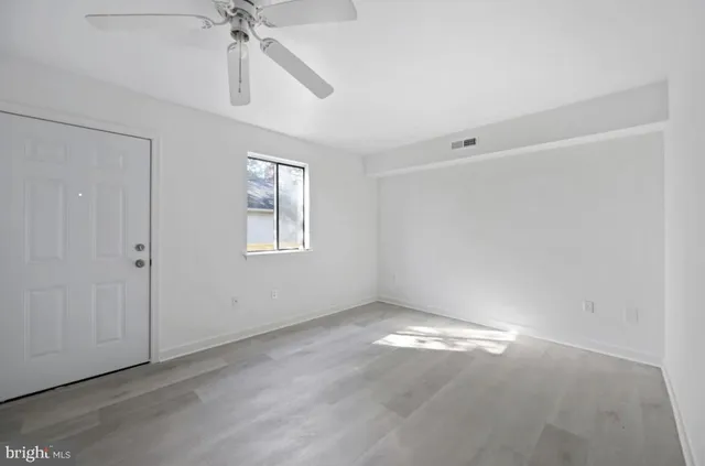 a view of an empty room with a window