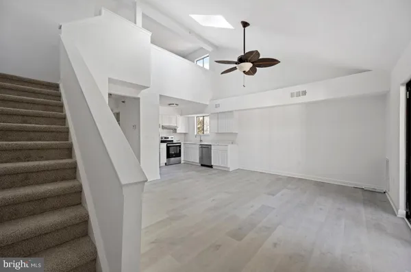 a view of staircase and kitchen view
