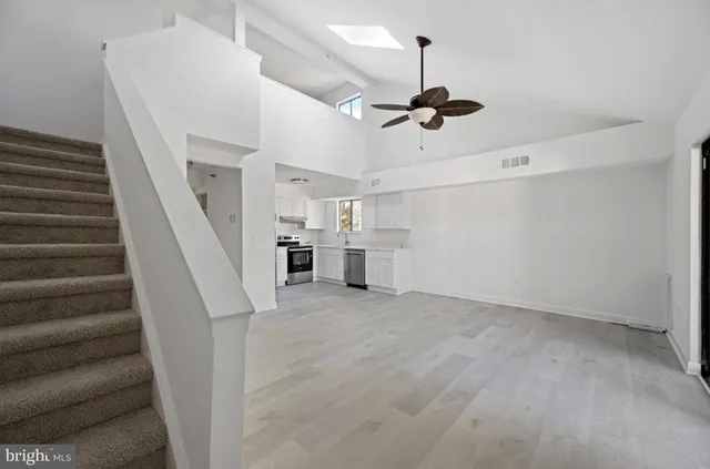 a view of staircase and kitchen view