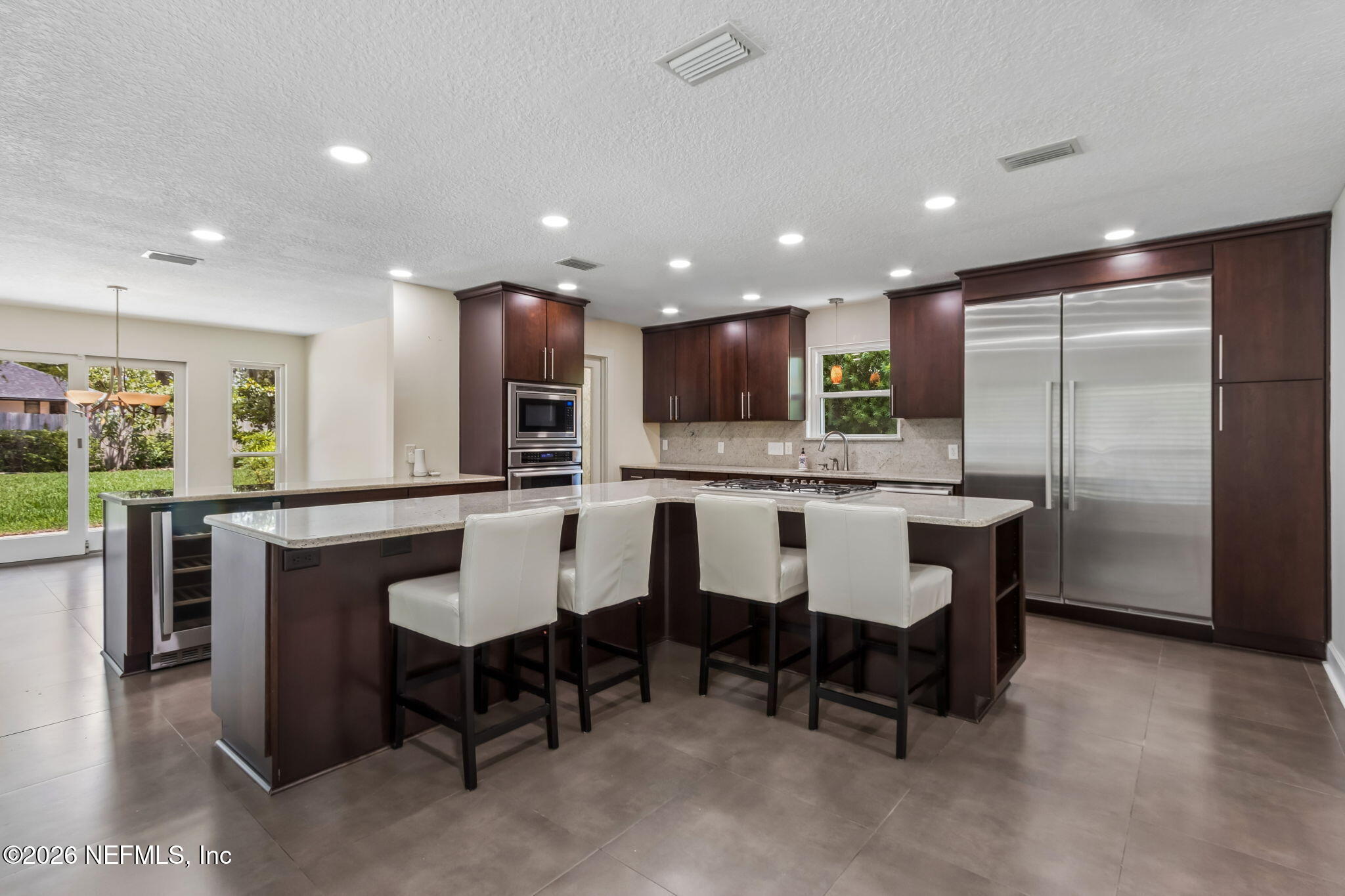 1877 Christopher Point Road South Jacksonville, FL 32217 - Photo 4 of 27 a large kitchen with a table and chairs