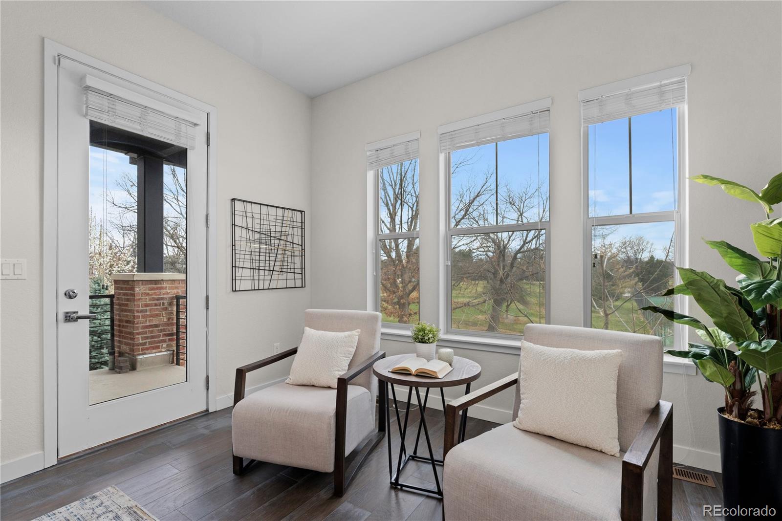 188 South Locust Street Denver, CO 80224 - Photo 11 of 29 a living room with furniture and a potted plant
