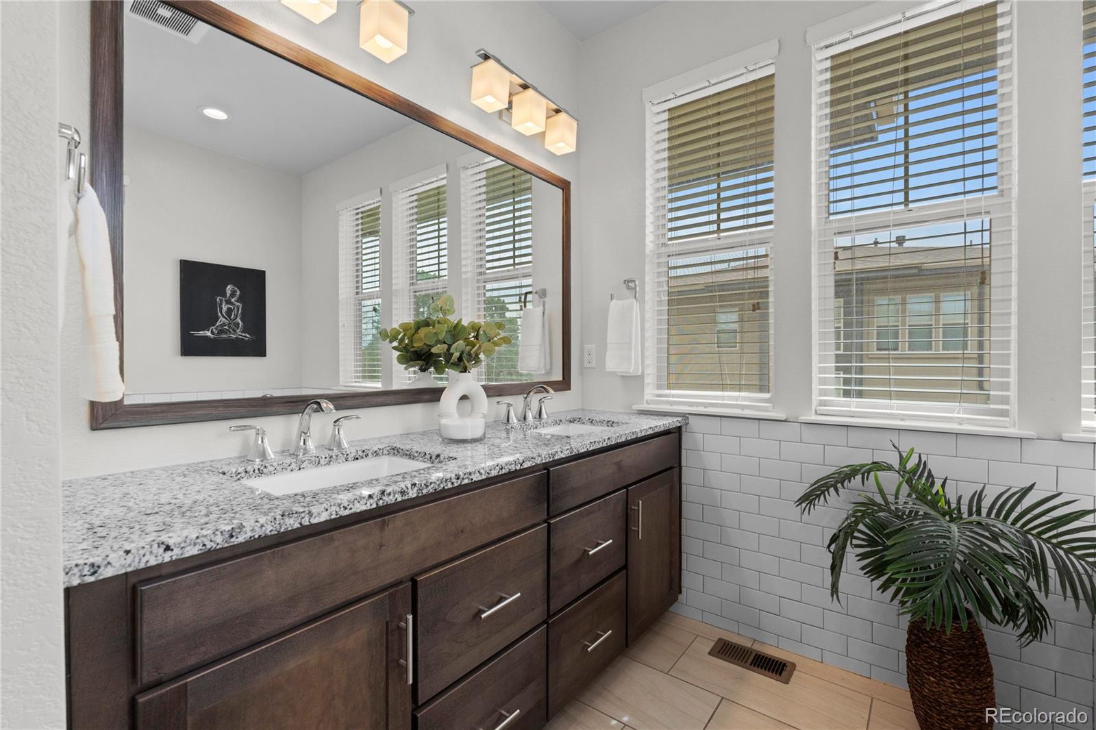 188 South Locust Street Denver, CO 80224 - Photo 16 of 29 a bathroom with a granite countertop sink mirror and window