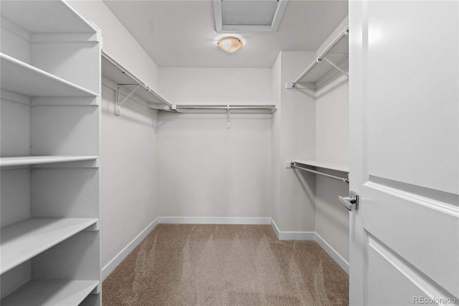 188 South Locust Street Denver, CO 80224 - Photo 17 of 29 a view of walk in closet with empty racks