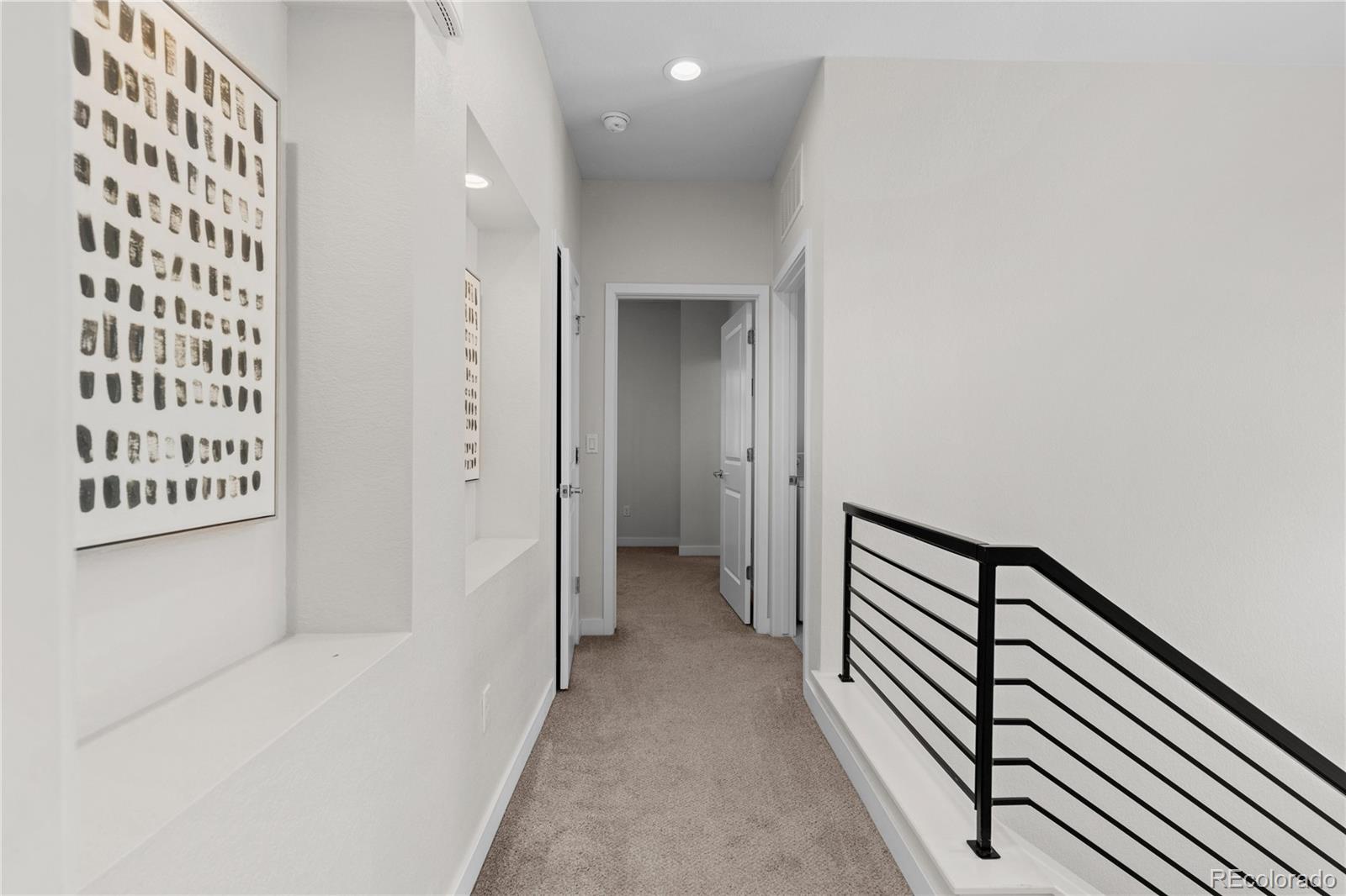188 South Locust Street Denver, CO 80224 - Photo 18 of 29 a view of a hallway with wooden floor and staircase