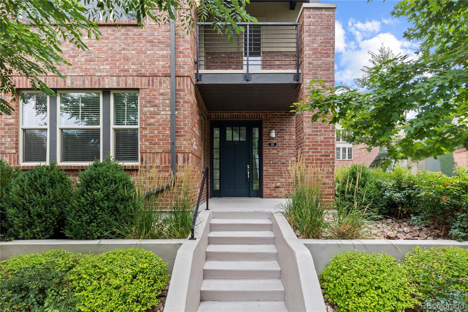 188 South Locust Street Denver, CO 80224 - Photo 2 of 29 a front view of a house with a yard