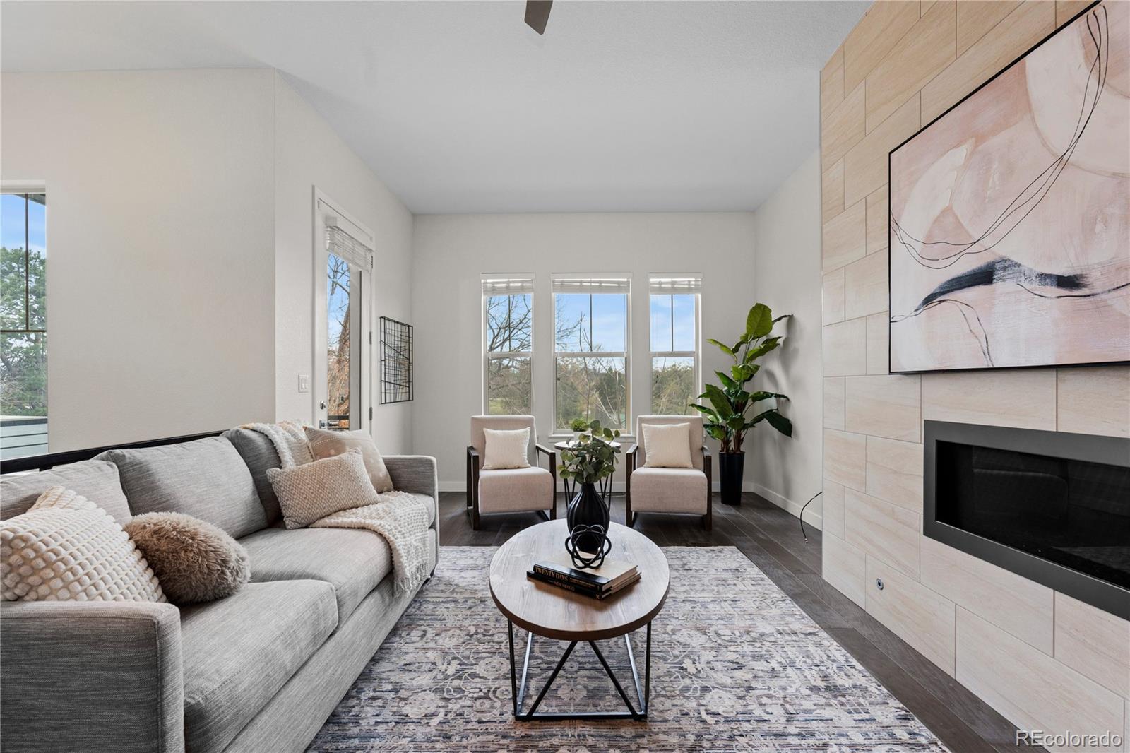 188 South Locust Street Denver, CO 80224 - Photo 3 of 29 a living room with furniture and a fireplace