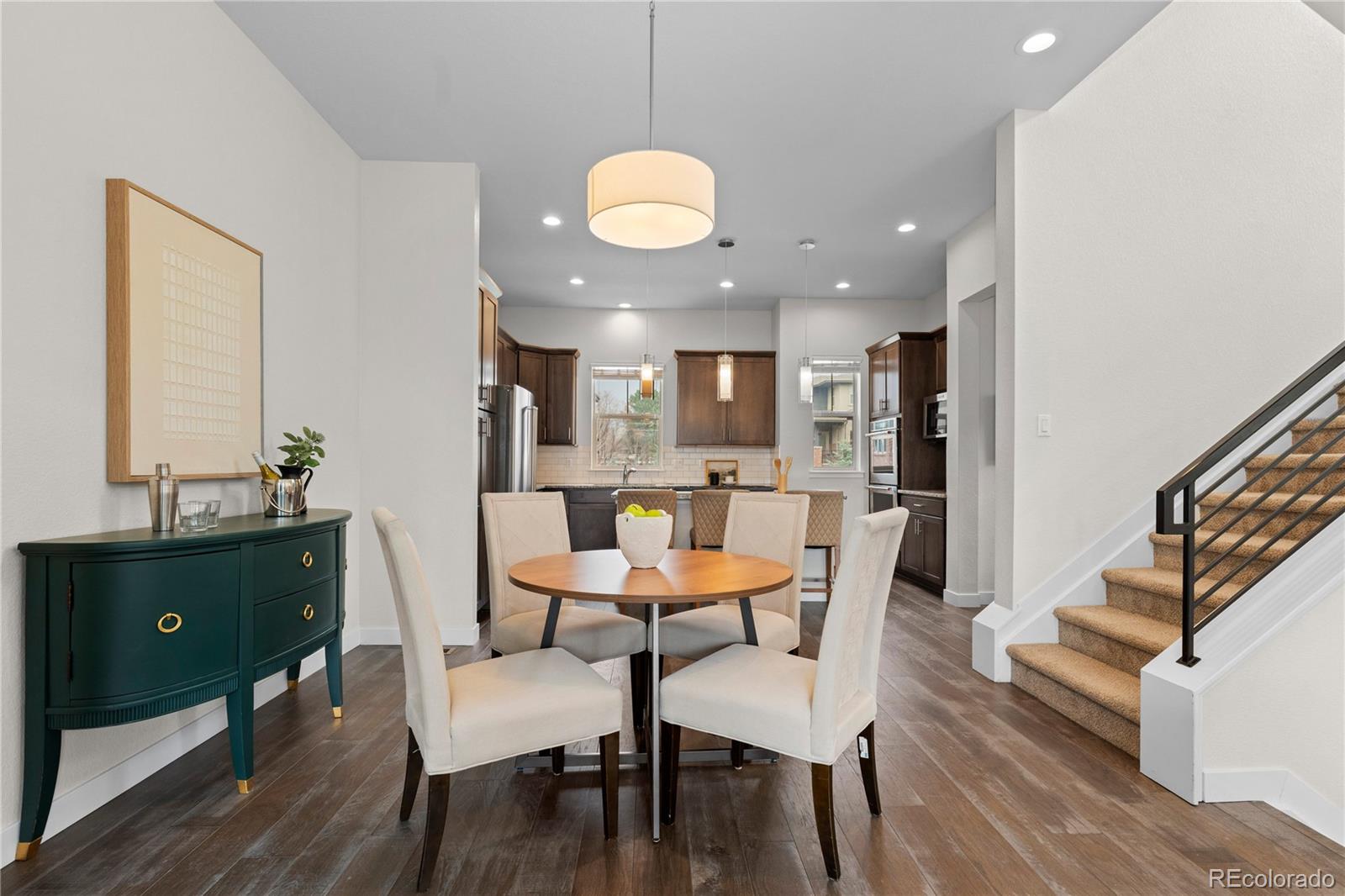 188 South Locust Street Denver, CO 80224 - Photo 4 of 29 a view of a dining room with furniture window and wooden floor