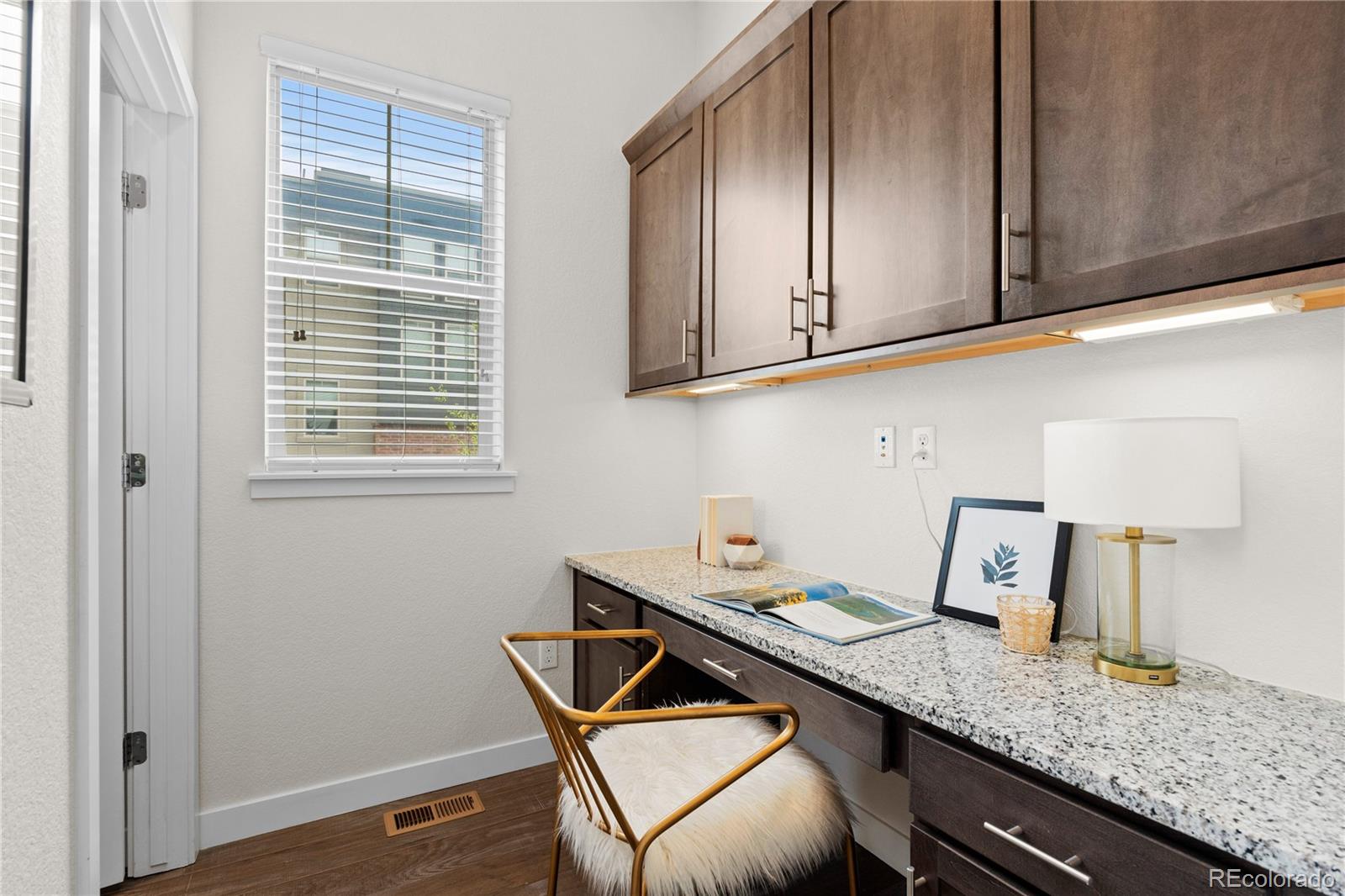 188 South Locust Street Denver, CO 80224 - Photo 8 of 29 a room with a sink cabinets and wooden floor