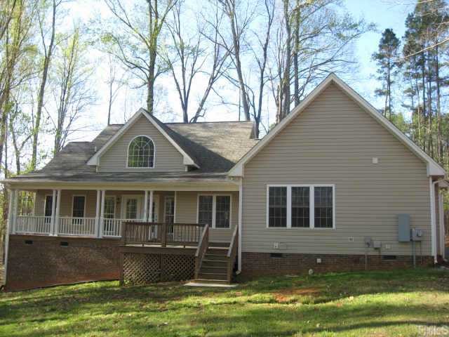 1100 John Oakes Road Timberlake, NC 27583 - Photo 7 of 7 a front view of a house with a yard
