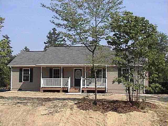 a house with a tree in the background