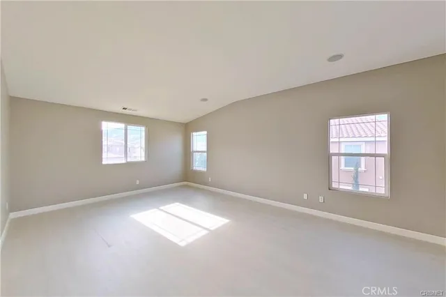 a view of empty room with windows