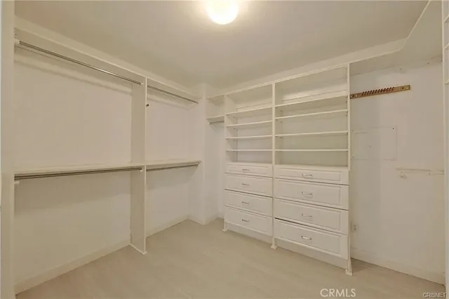 a view of an empty walk in closet