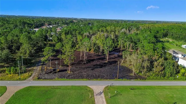 a view of a garden with a patio
