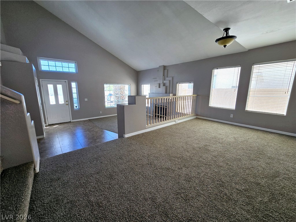 3759 Funston Way Las Vegas, NV 89129 - Photo 23 of 31 A spacious living area with vaulted ceilings and abundant natural light creates an inviting atmosphere.