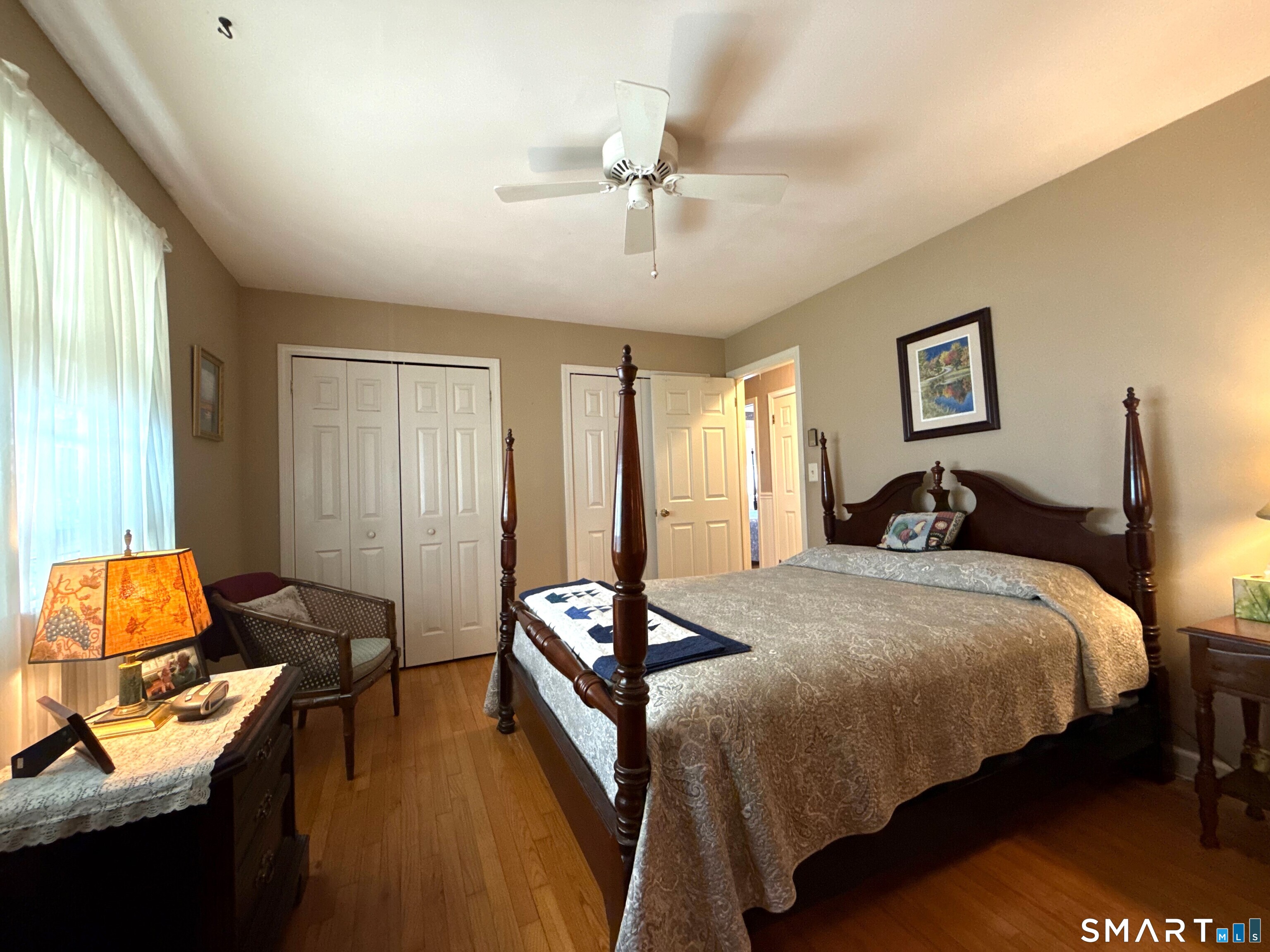 15 Grove Street Deep River, CT 06417 - Photo 12 of 25 a bedroom with a bed and wooden floor