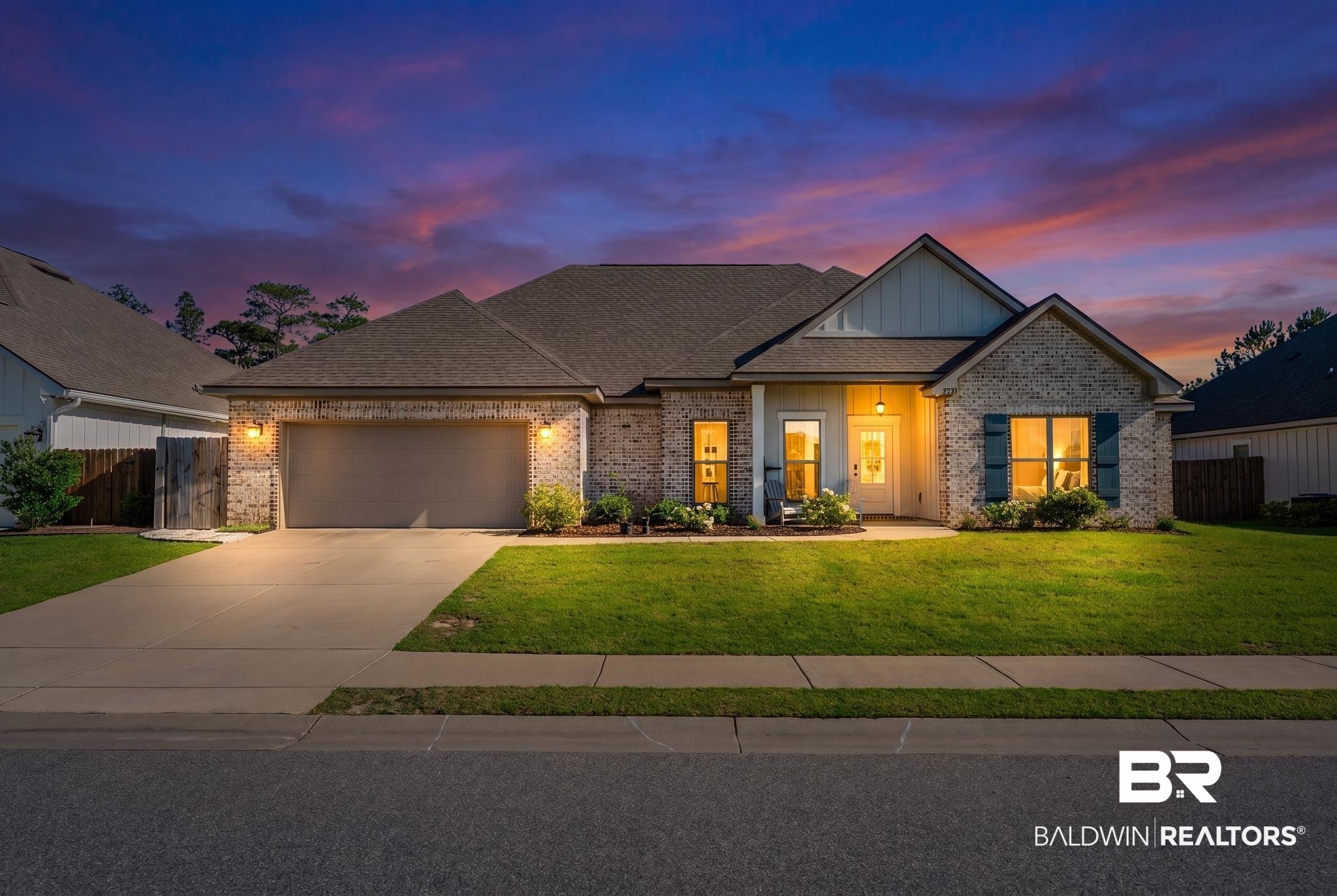 7872 Calverton Street Foley, AL 36535 - Photo 1 of 76 Brick exterior with board and batten accents, a covered entry, and a two-car garage