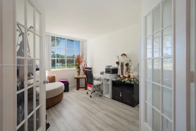 a bedroom with furniture and a window