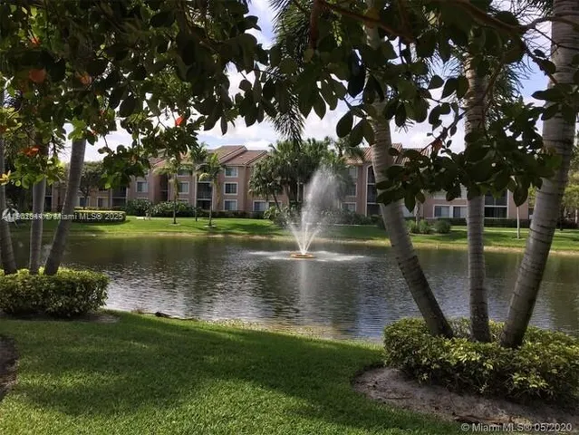 a view of a lake with a building in the background