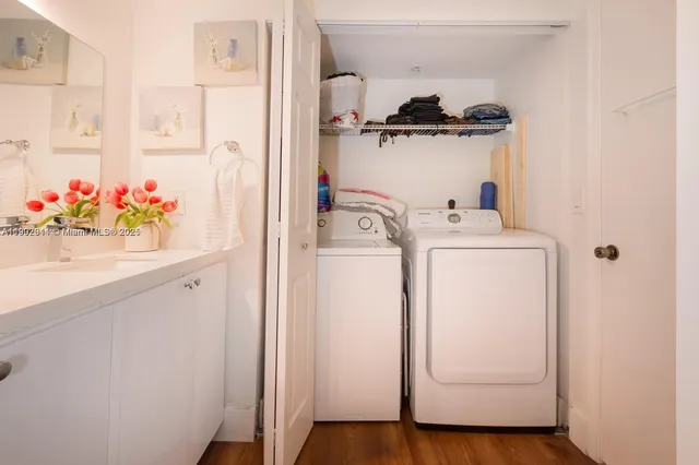 a view of storage and utility room with washer and dryer