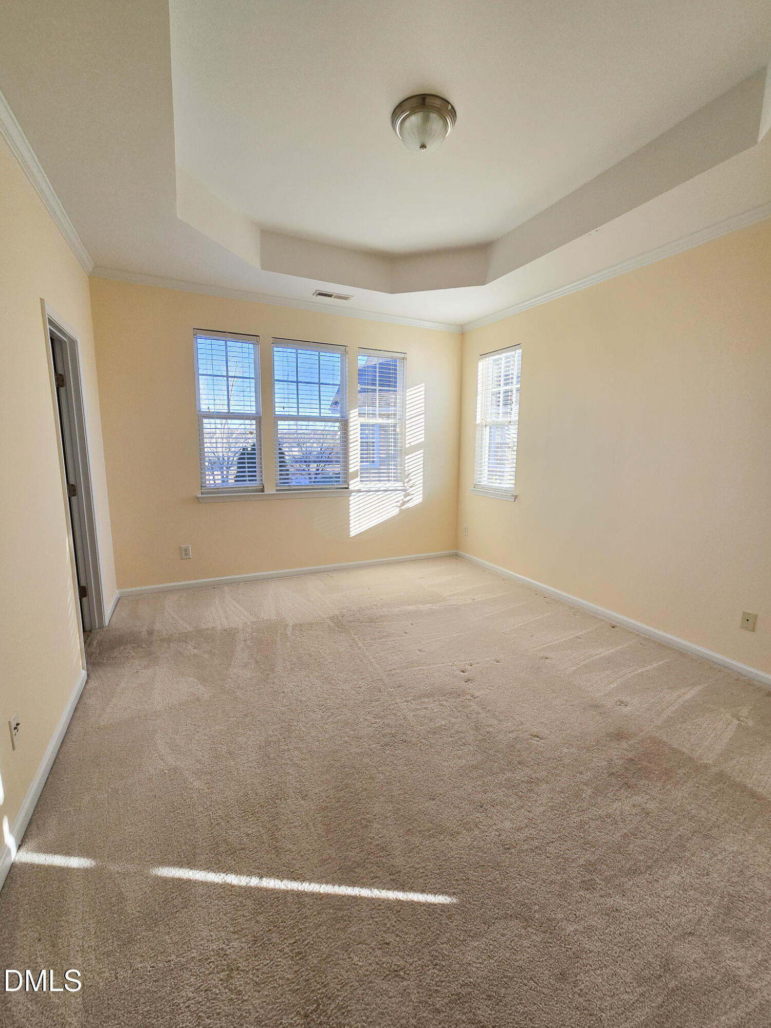 10104 Raven Tree Drive Raleigh, NC 27617 - Photo 13 of 33 an empty room with windows