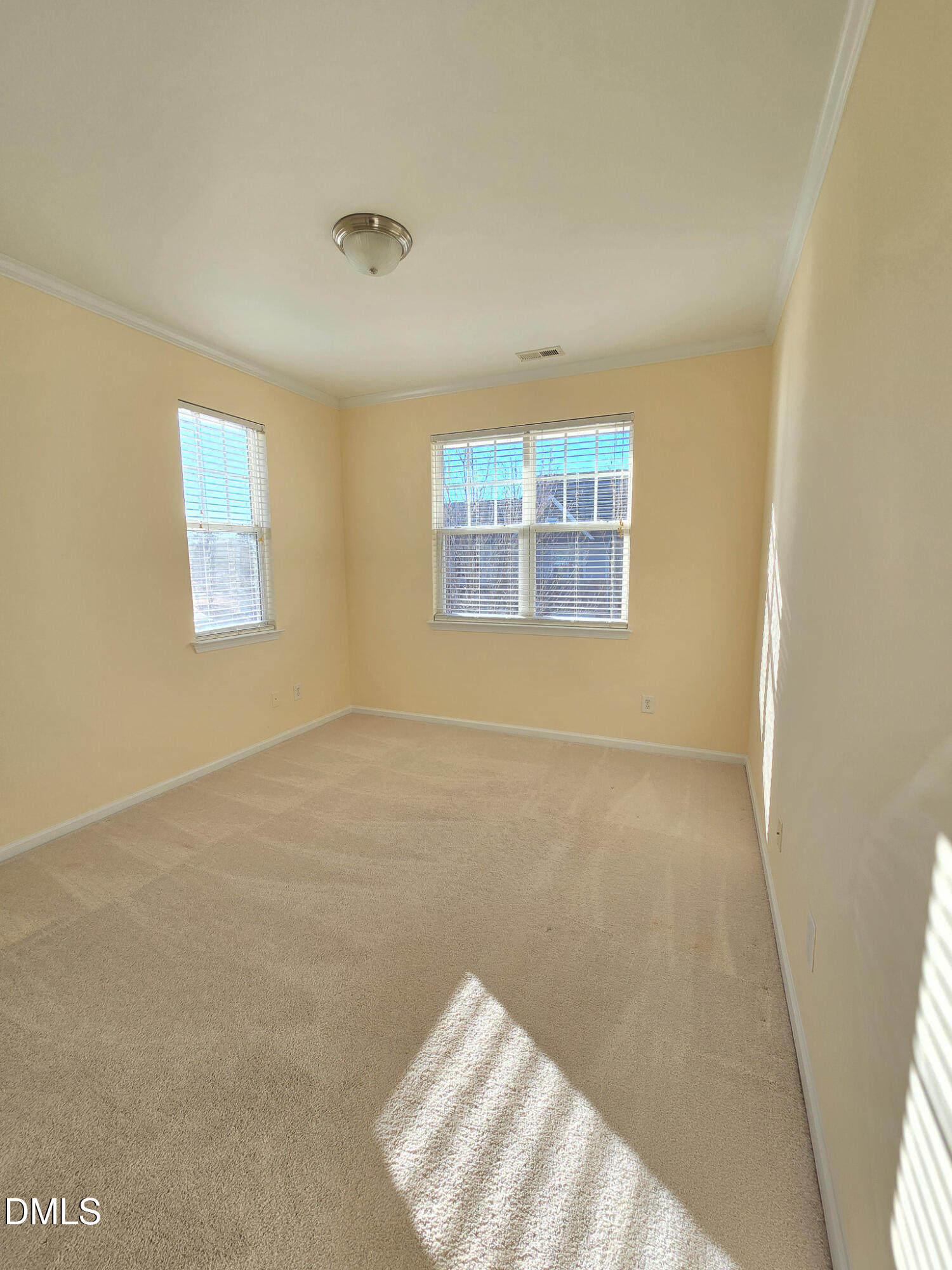 10104 Raven Tree Drive Raleigh, NC 27617 - Photo 20 of 33 a view of an empty room and window